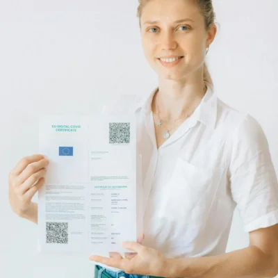 Woman in White Button Up Shirt Holding White Printer Paper